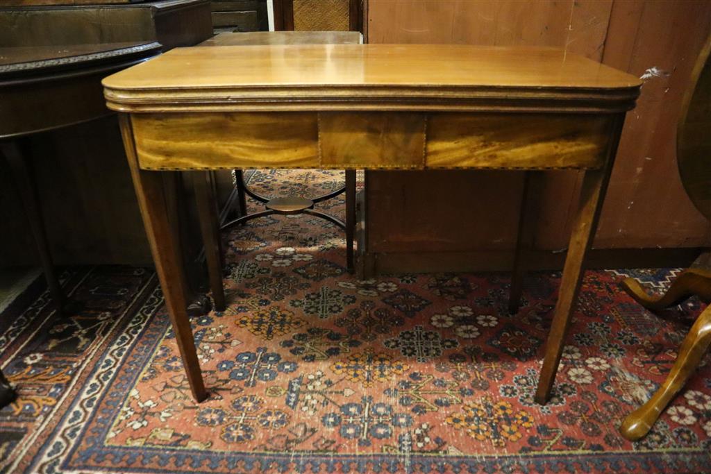 A George III mahogany folding top D-shaped tea table, width 91cm, depth 45cm, height 73cm